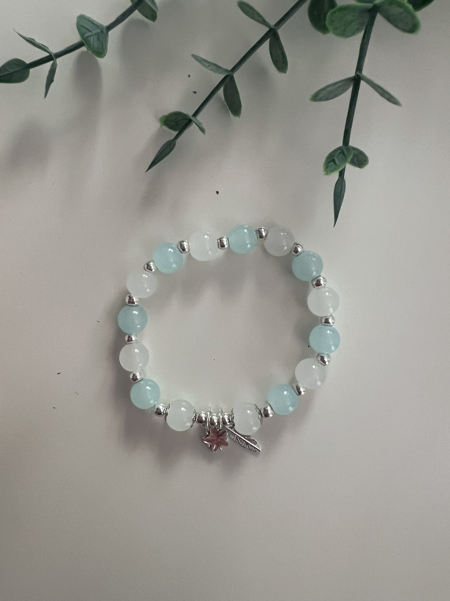 Perlenarmband „Stern & Feder“